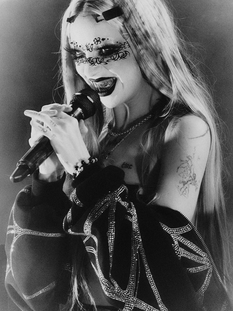 Portrait of Bambie Thug performing in their diamond grillz