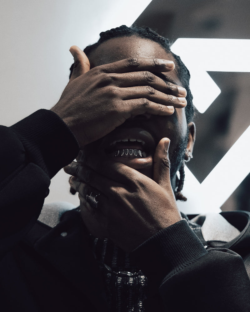 close up of face with silver grillz