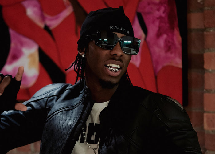 Tide Sterling wearing silver grillz
